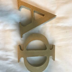 Gold painted Alpha Phi letters